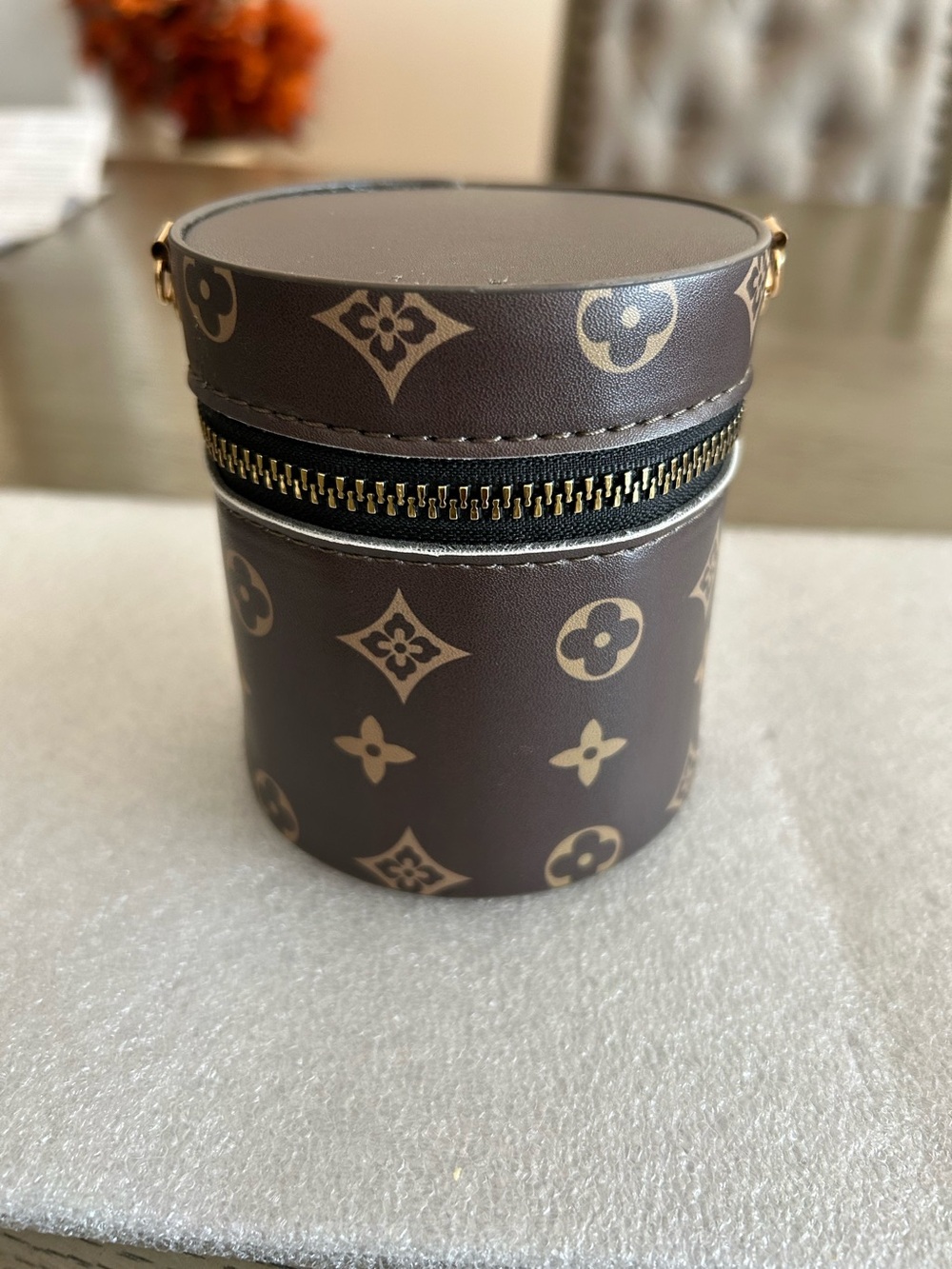 Brown Monogram Round Travel lip gloss bag with Zip Closure.